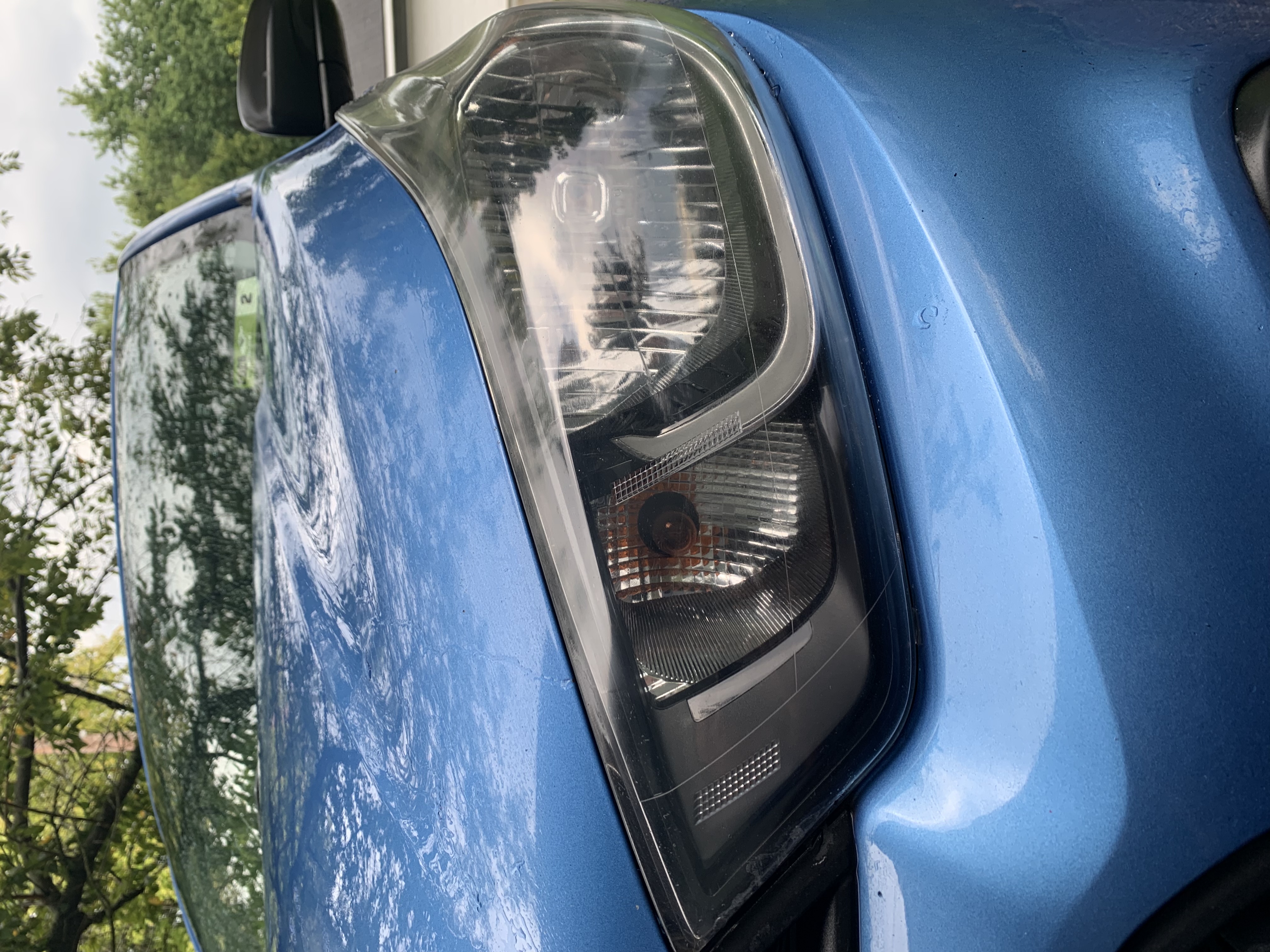 Clear, restored headlight lens after restoration