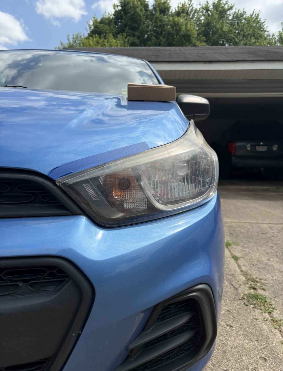 Hazy, oxidized headlight lens before restoration